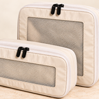 Beige packing cubes — mesh and zipper detail