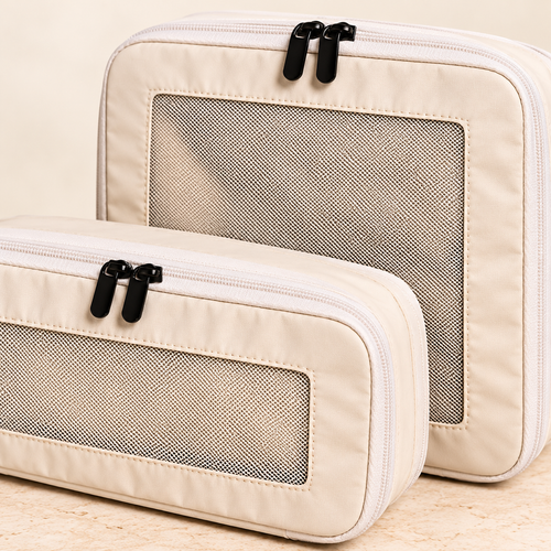 Beige packing cubes — mesh and zipper detail