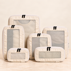 Beige six-piece compression packing cubes — full view