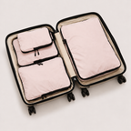 Pink compression packing cubes — colour reference showing four cubes; choose set size separately